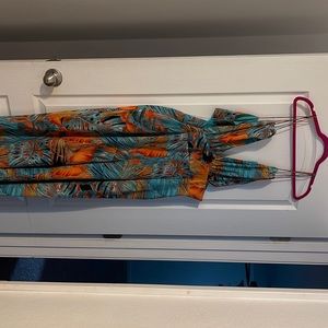 Multi colored spaghetti strap jumper. Opening on both sides. Very cute!